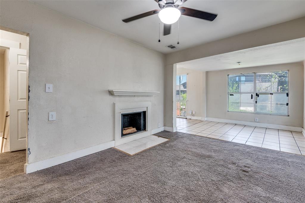 1015 Kings Highway Dallas, TX 75208 - Photo 2 of 15 a view of an empty room with a fireplace