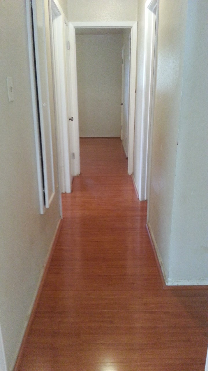 15829 Ridgeroe Lane Houston, TX 77053 - Photo 12 of 15 a view of a hallway with wooden floor