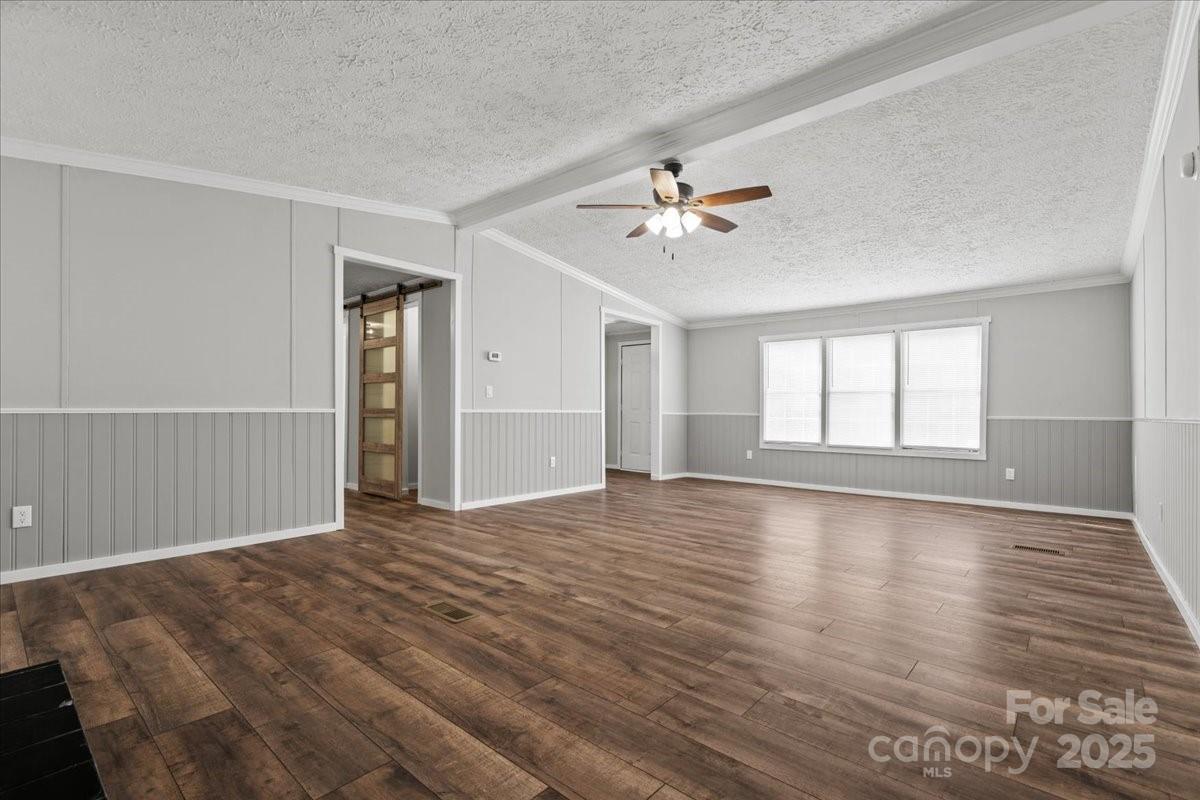 273 Adams Road Chesterfield, SC 29709 - Photo 11 of 47 a view of an empty room with a window and wooden floor