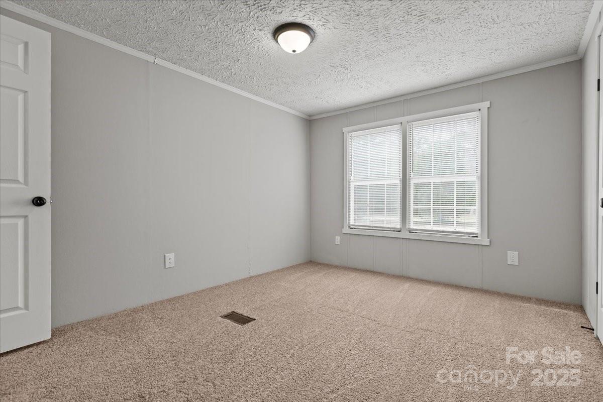 273 Adams Road Chesterfield, SC 29709 - Photo 15 of 47 a view of an empty room with a window