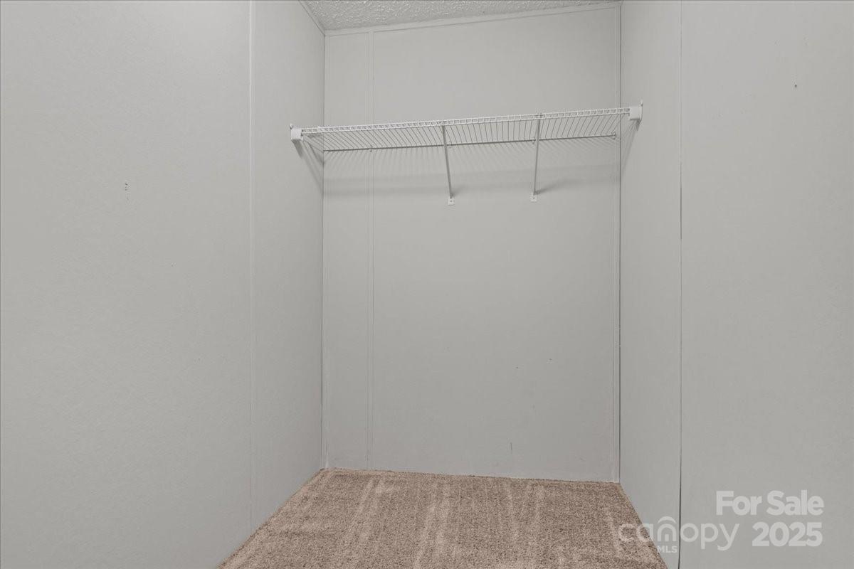 273 Adams Road Chesterfield, SC 29709 - Photo 19 of 47 a view of a room with racks on the wall