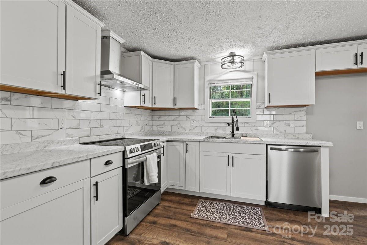 273 Adams Road Chesterfield, SC 29709 - Photo 21 of 47 a kitchen with stainless steel appliances granite countertop a sink stove and cabinets