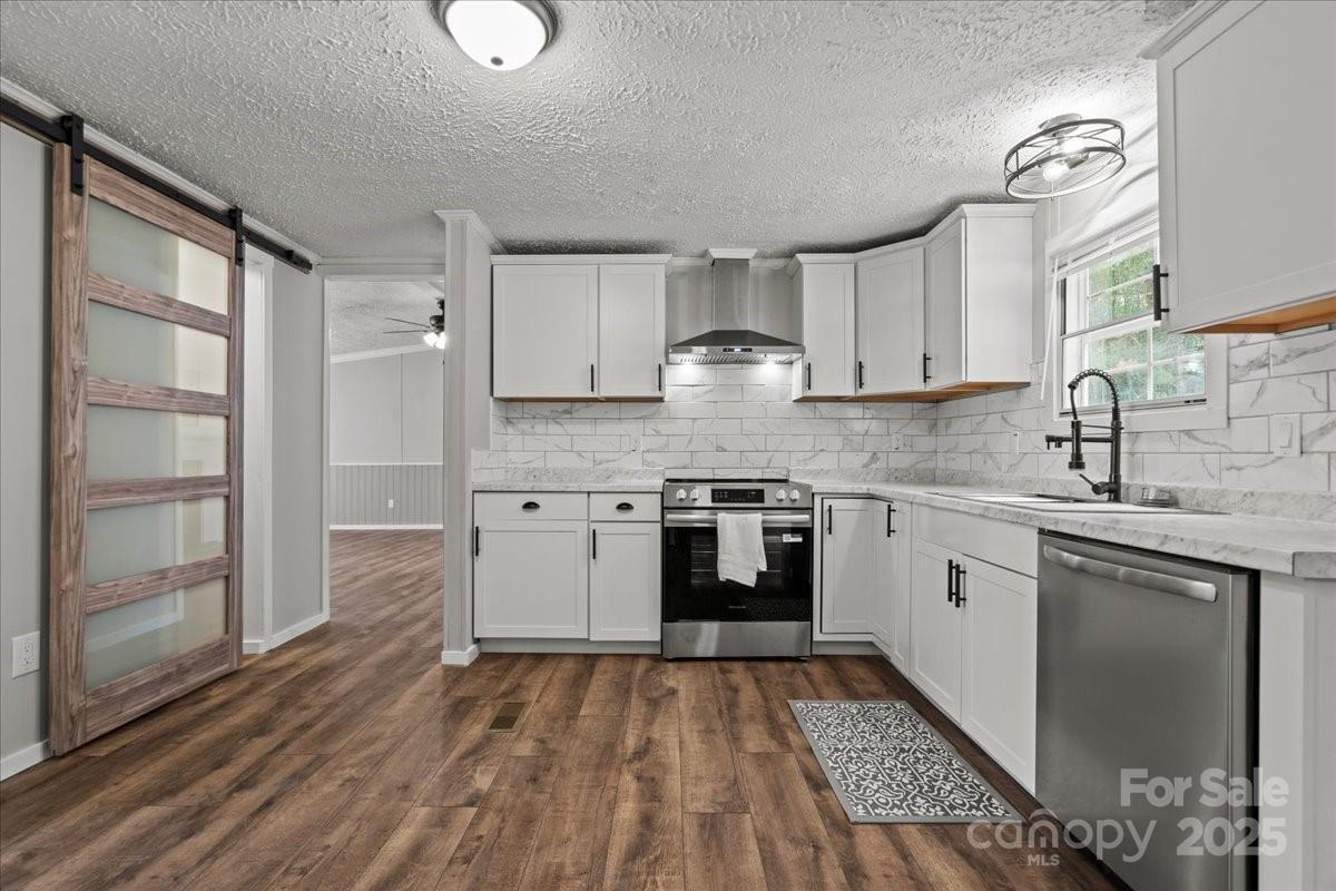 273 Adams Road Chesterfield, SC 29709 - Photo 23 of 47 a kitchen with a sink window and cabinets