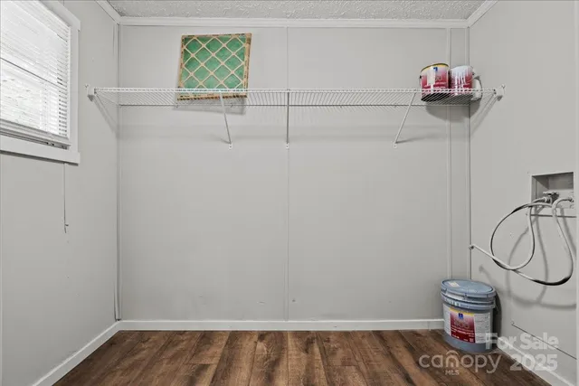a view of storage and utility room with racks on the wall