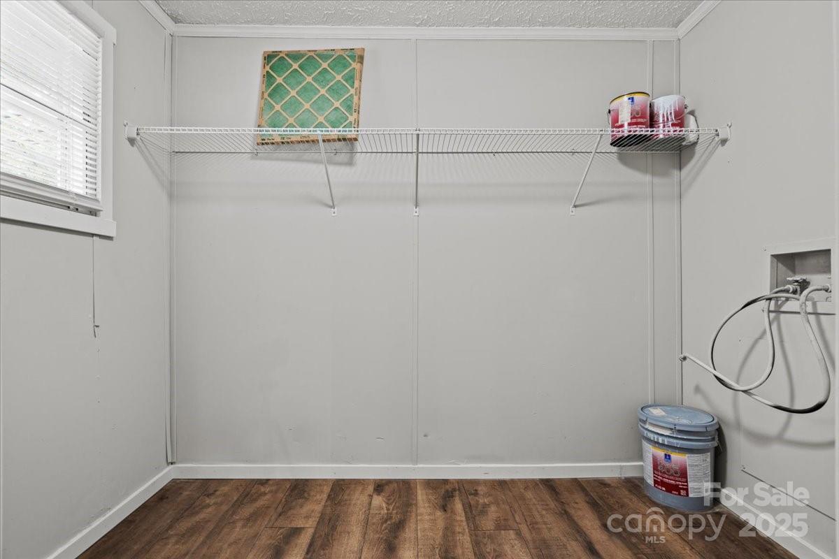 273 Adams Road Chesterfield, SC 29709 - Photo 26 of 47 a view of storage and utility room with racks on the wall