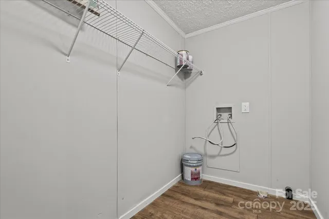 a view of a room with racks and white walls