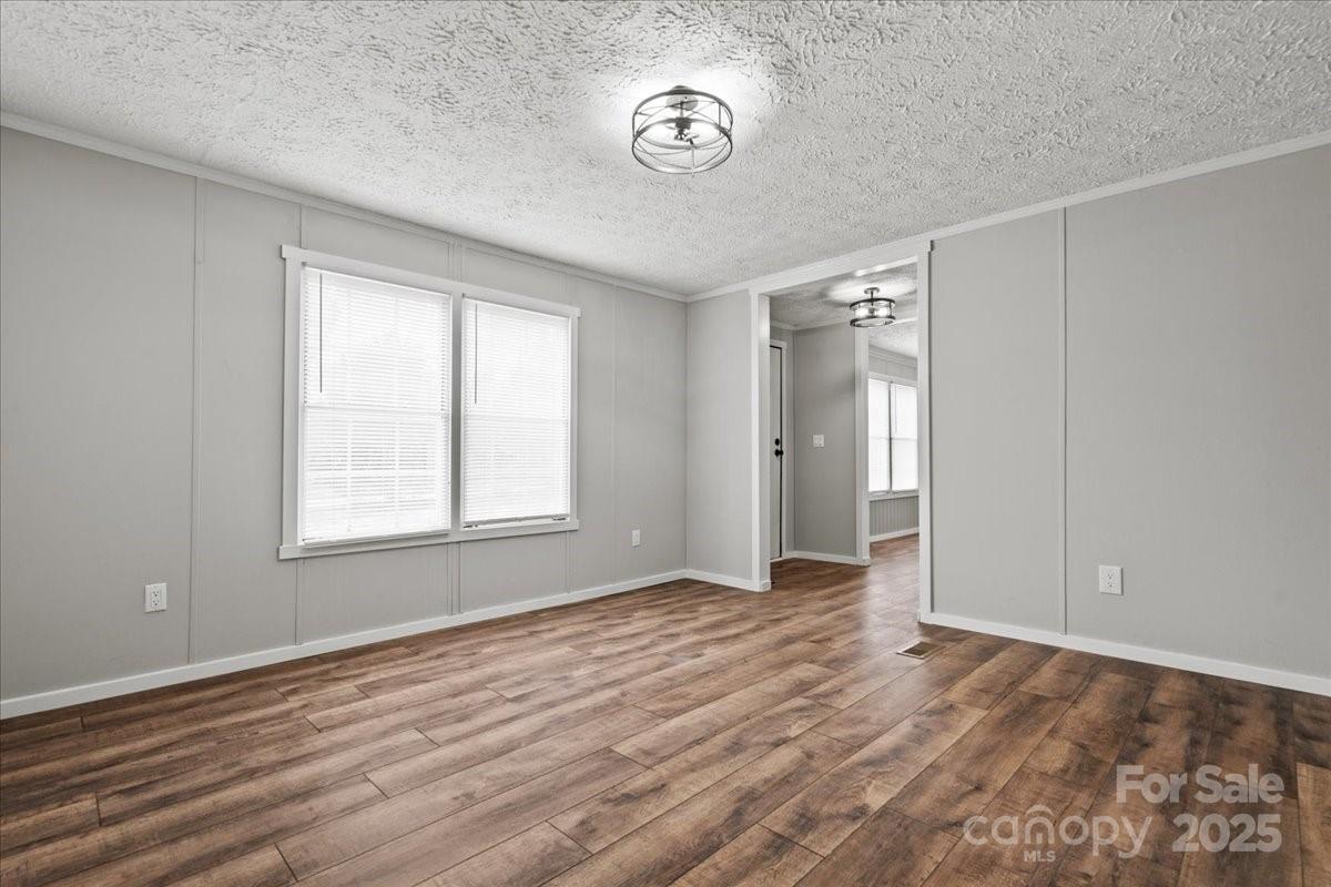 273 Adams Road Chesterfield, SC 29709 - Photo 29 of 47 a view of an empty room with wooden floor and a window