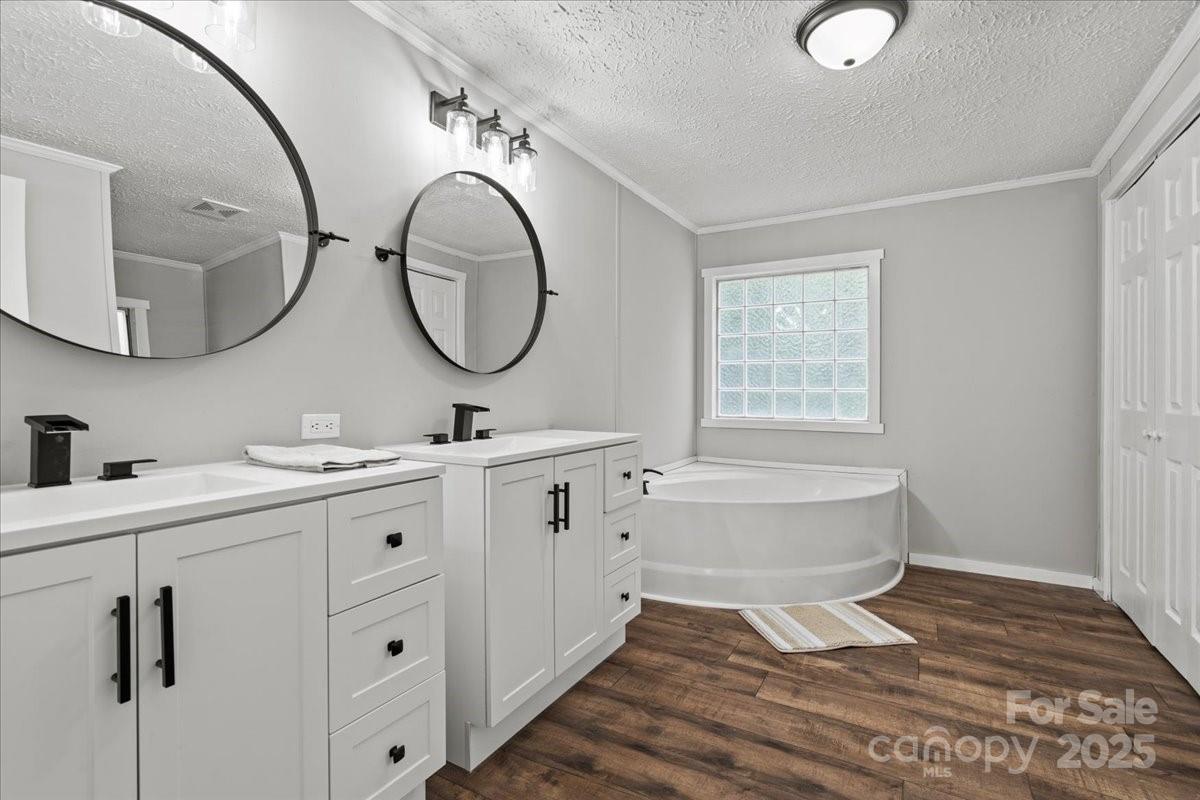 273 Adams Road Chesterfield, SC 29709 - Photo 33 of 47 a spacious bathroom with a double vanity sink mirror and bathtub