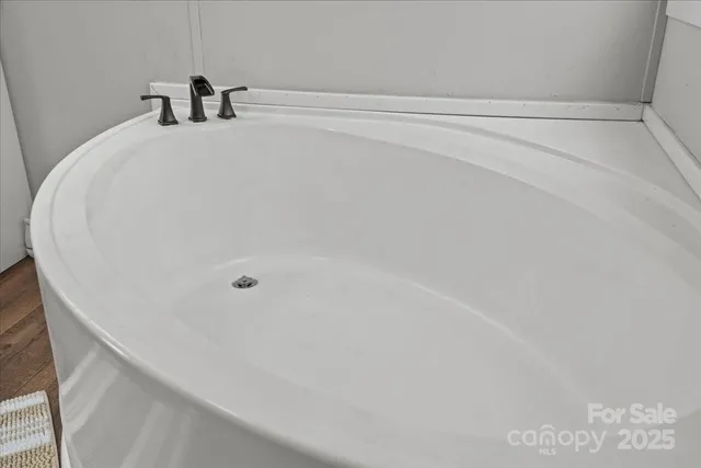 a bathroom with a white bath tub