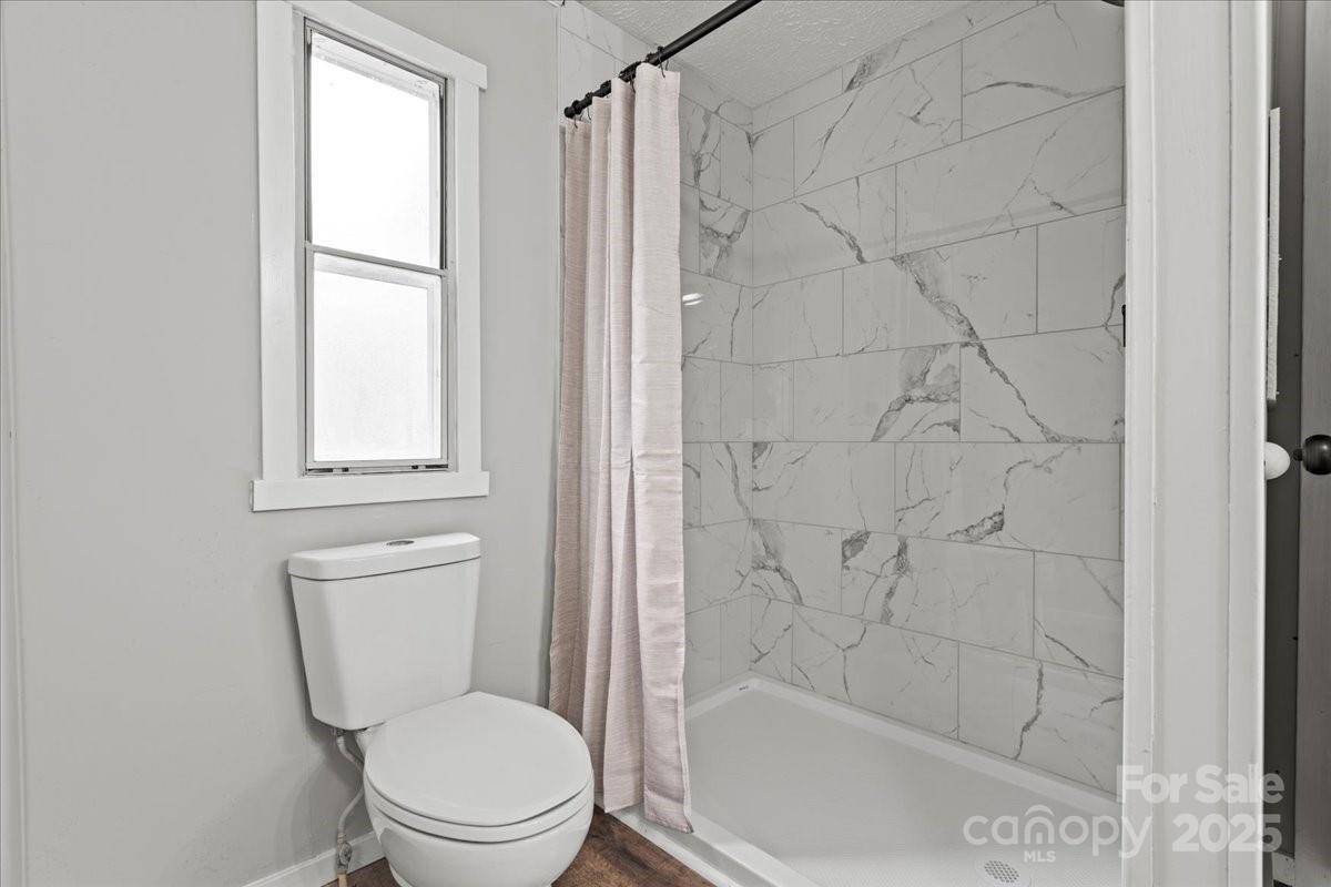 273 Adams Road Chesterfield, SC 29709 - Photo 38 of 47 a white toilet sitting next to a shower