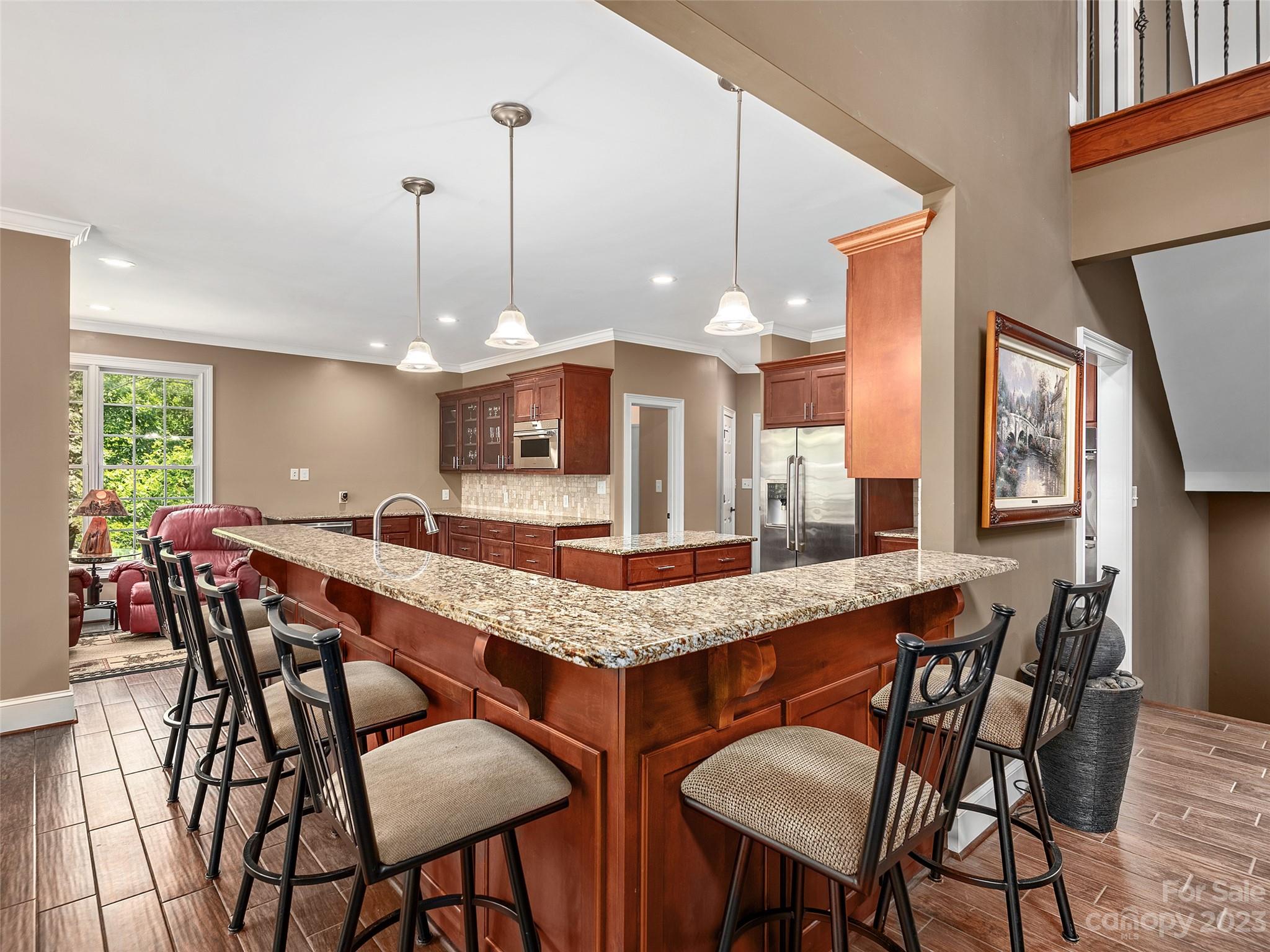 1131 South Cove Road Mill Spring, NC 28756 - Photo 7 of 48 a dining table chairs and a wooden floor