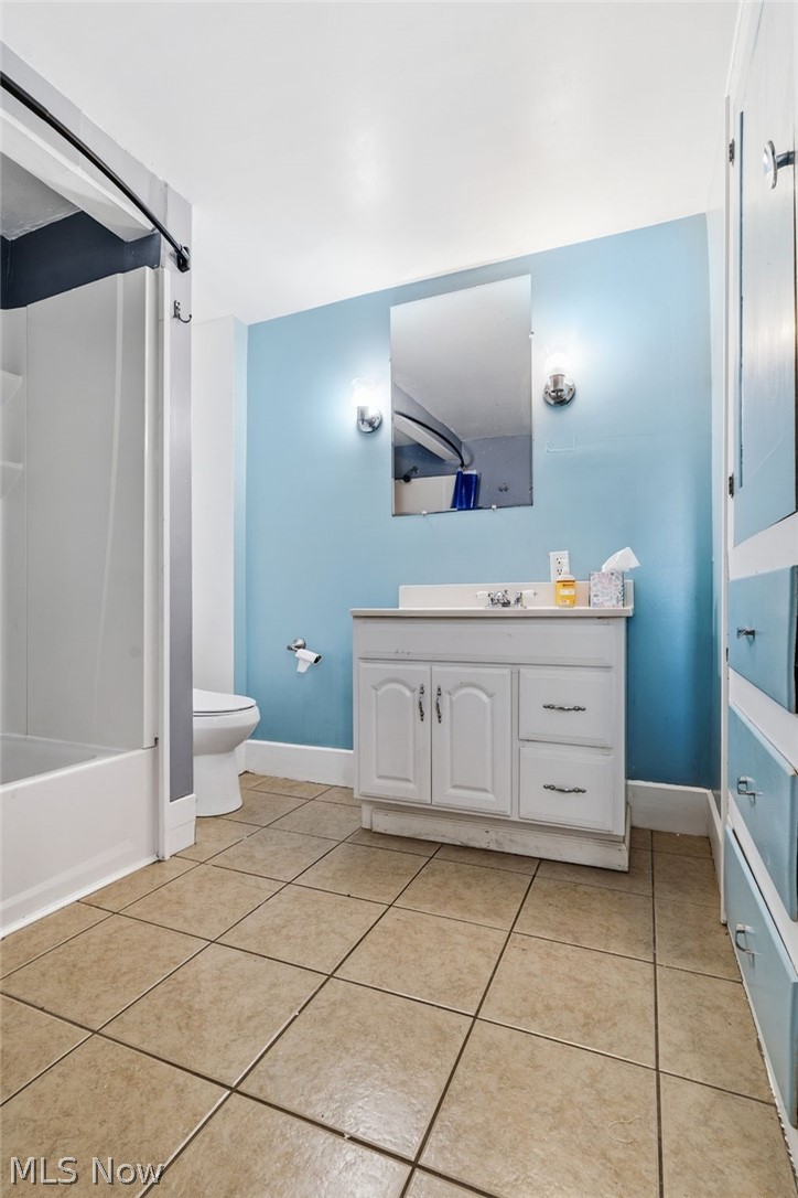 619 Garry Road Akron, OH 44305 - Photo 14 of 28 White vanity with cabinet and drawer storage, framed mirror, and dual wall sconces