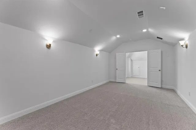 a view of a house with a yard and a garden