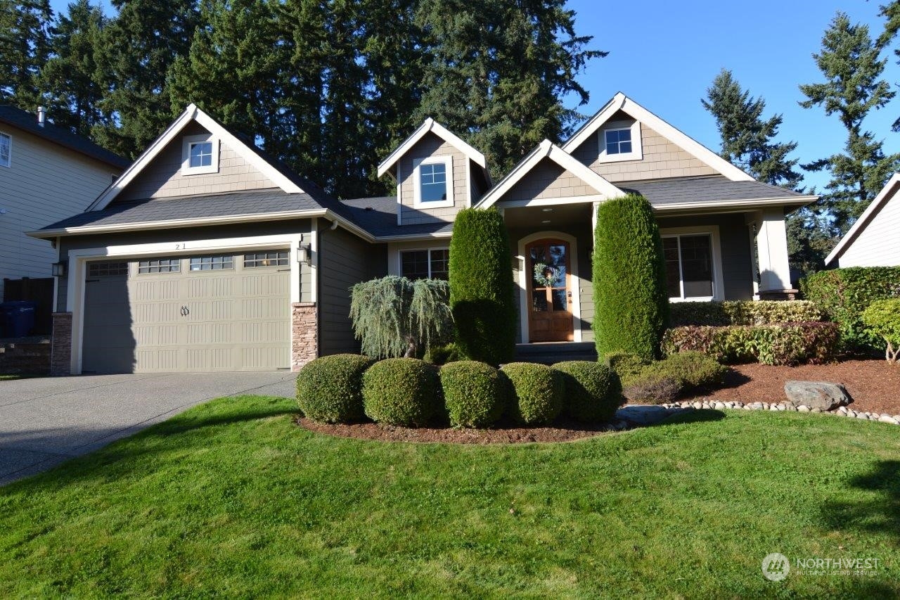 21 233rd Place Southeast Bothell, WA 98021 - Photo 1 of 33 a front view of a house with a garden