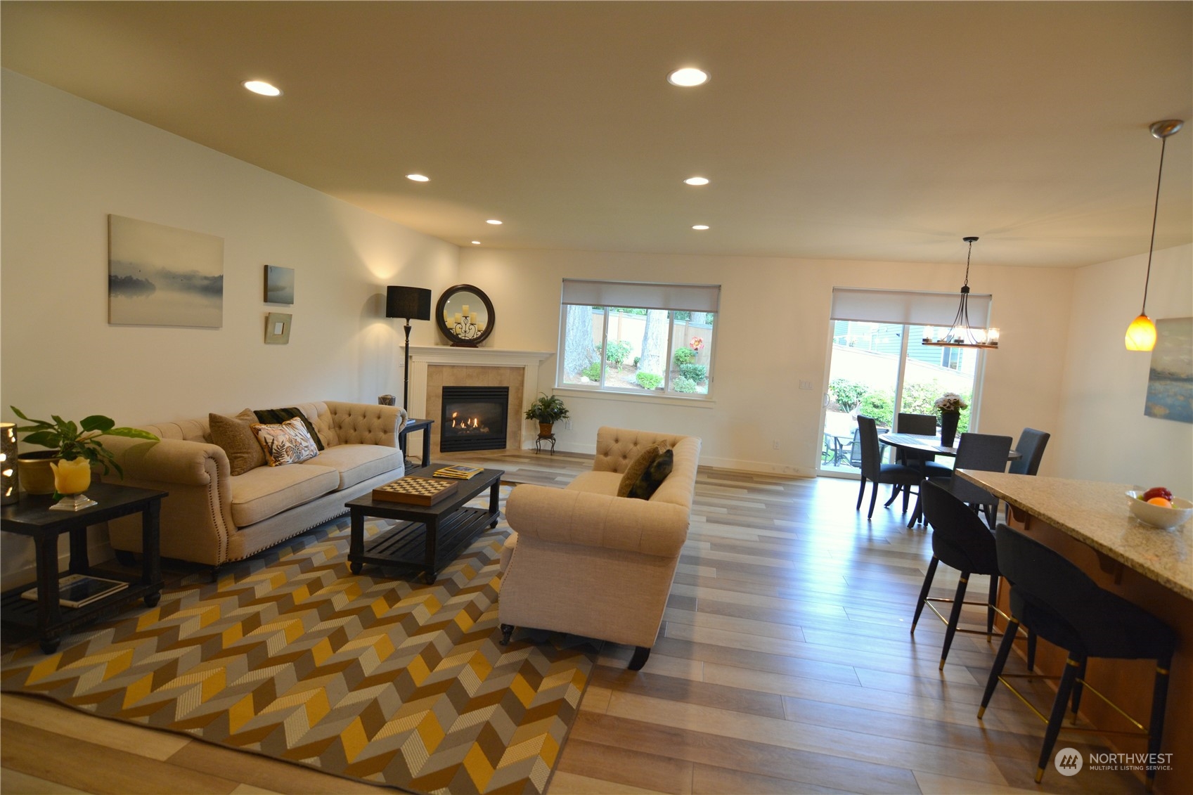 21 233rd Place Southeast Bothell, WA 98021 - Photo 13 of 33 a living room with furniture dining table and a fireplace