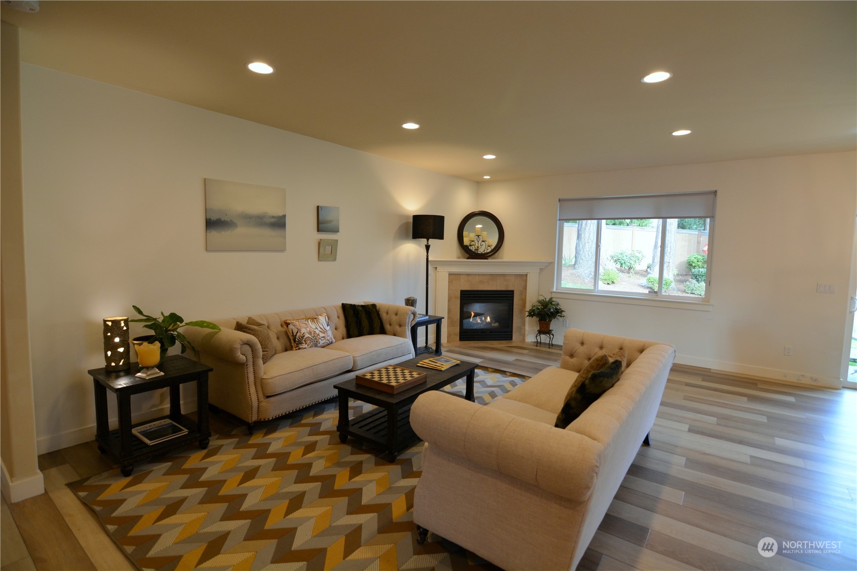 21 233rd Place Southeast Bothell, WA 98021 - Photo 14 of 33 a living room with furniture and a fireplace