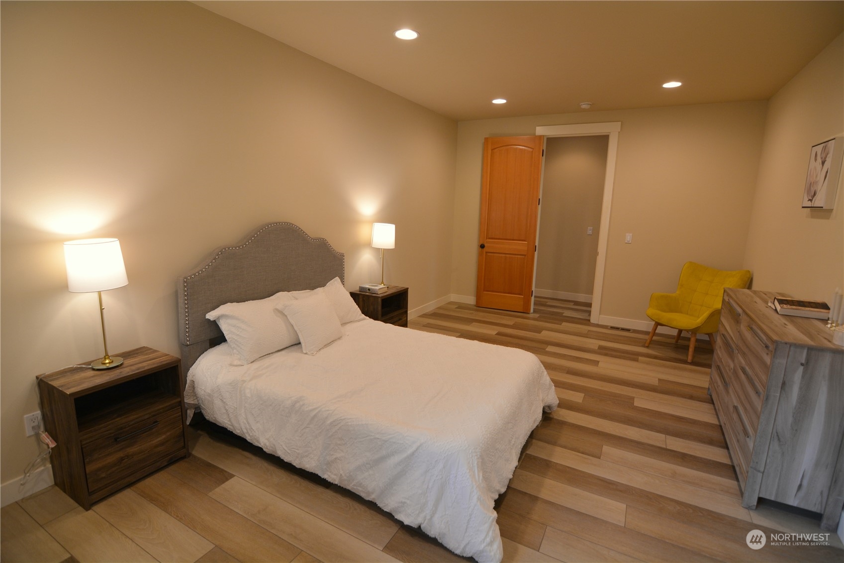 21 233rd Place Southeast Bothell, WA 98021 - Photo 19 of 33 a spacious bedroom with a bed and a lamp