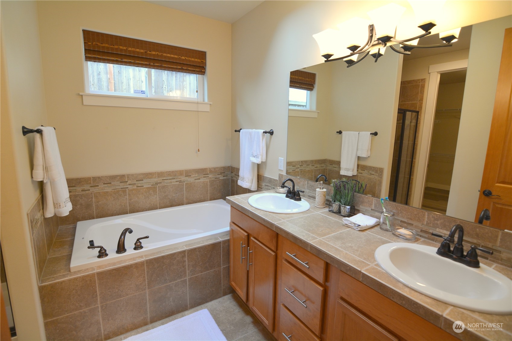 21 233rd Place Southeast Bothell, WA 98021 - Photo 20 of 33 a bathroom with a tub sink and mirror