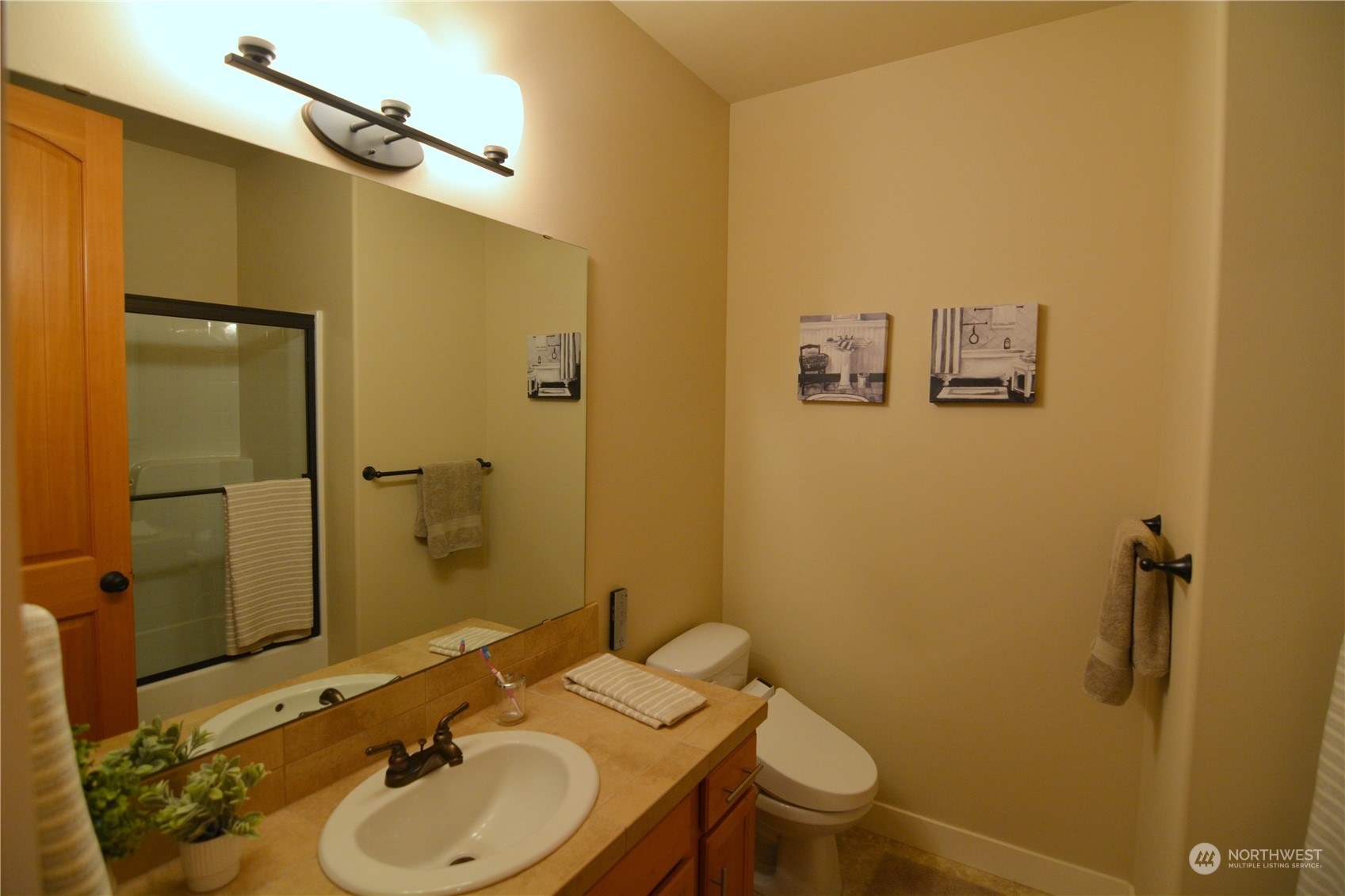 21 233rd Place Southeast Bothell, WA 98021 - Photo 26 of 33 a bathroom with a sink mirror vanity and toilet