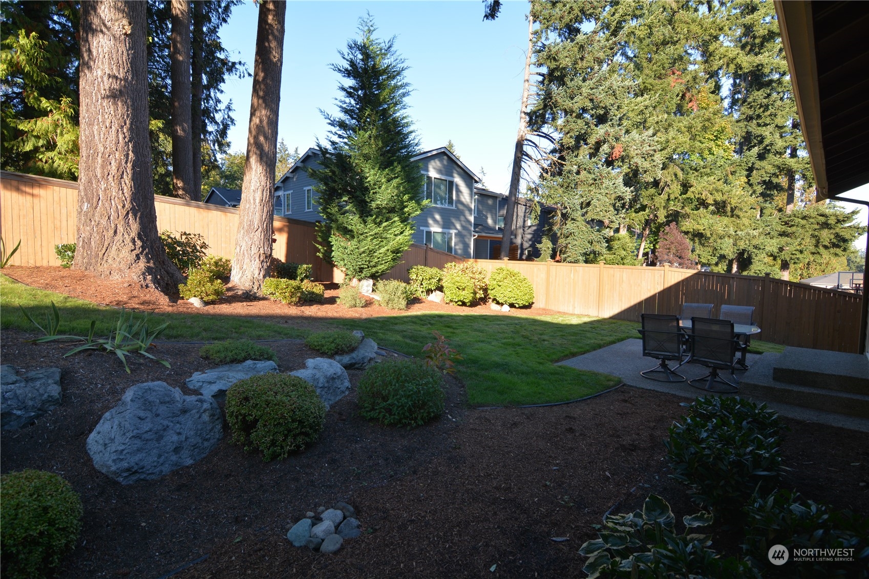 21 233rd Place Southeast Bothell, WA 98021 - Photo 28 of 33 a view of a backyard with plants and trees