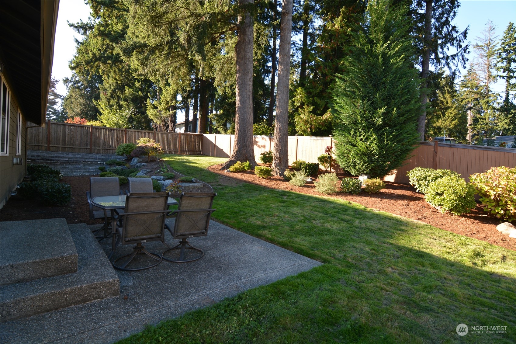 21 233rd Place Southeast Bothell, WA 98021 - Photo 29 of 33 a view of a backyard with sitting area