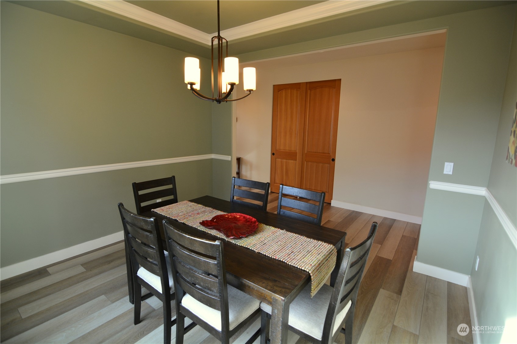 21 233rd Place Southeast Bothell, WA 98021 - Photo 9 of 33 a view of a dining room with furniture and chandelier