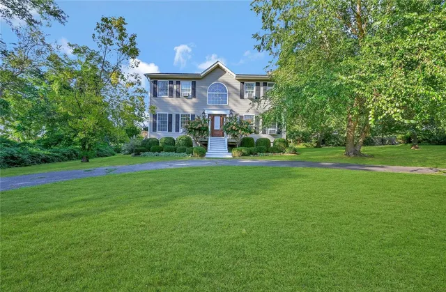 a front view of a house with a yard