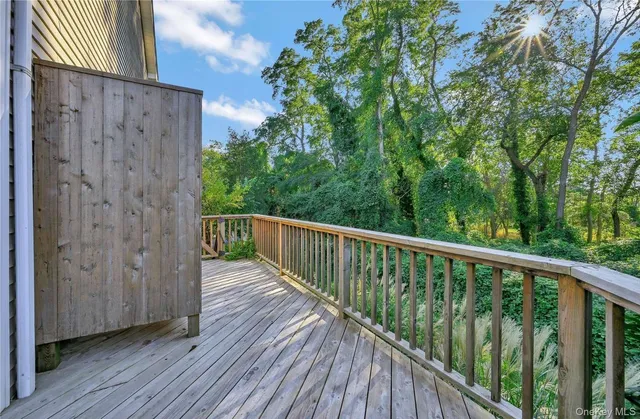 a balcony with wooden floor