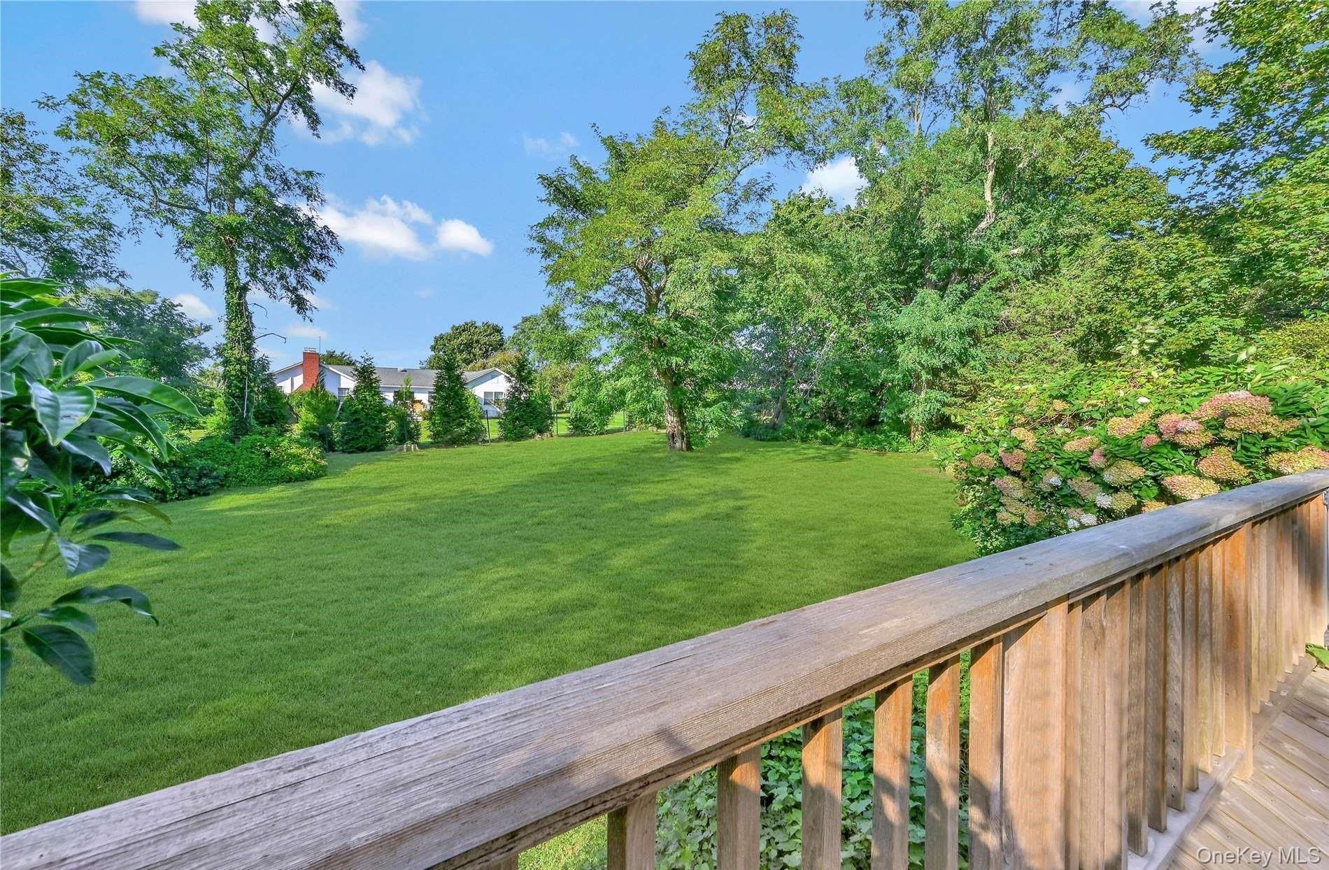 215 Kouros Road New Suffolk, NY 11956 - Photo 14 of 28 a view of a garden from a balcony