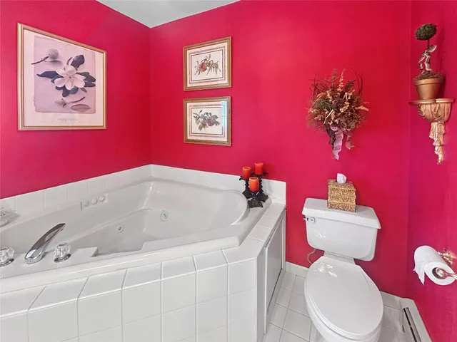 a bathroom with a sink mirror and toilet
