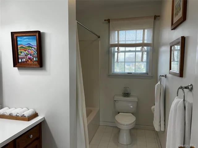 a bathroom with a toilet and a sink