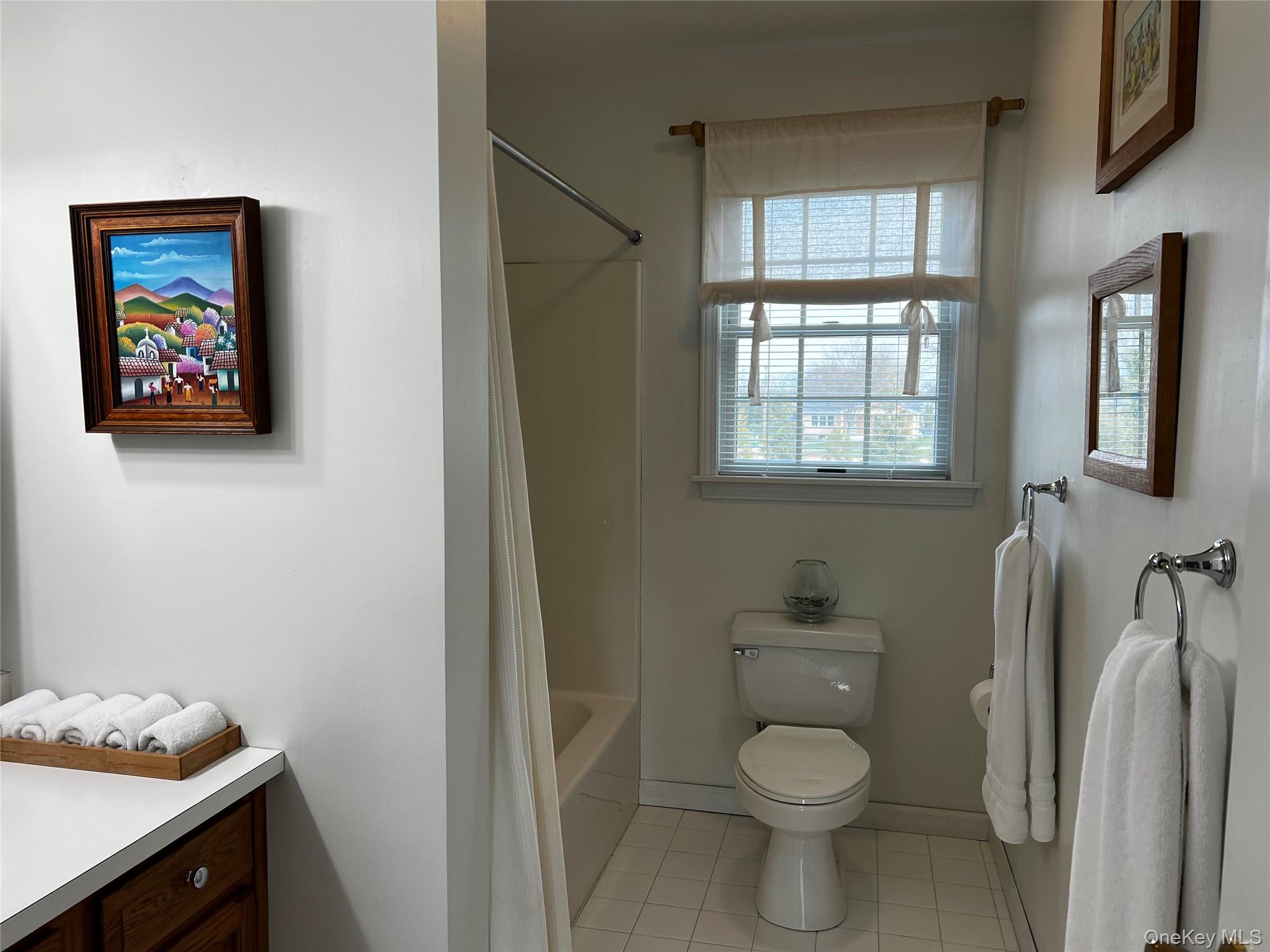 215 Kouros Road New Suffolk, NY 11956 - Photo 23 of 28 a bathroom with a toilet and a sink