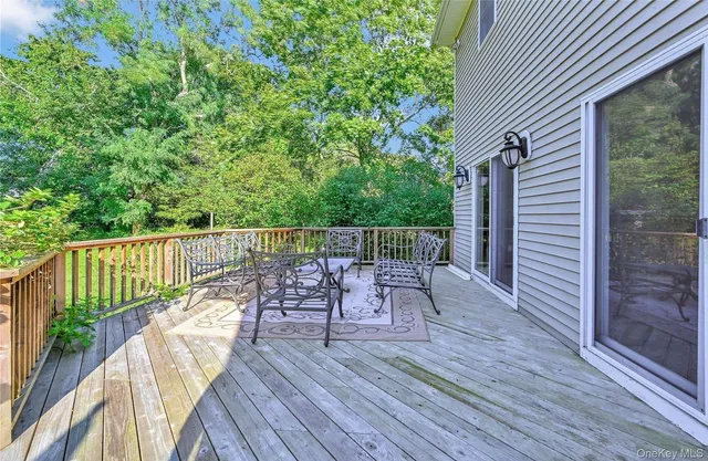 a view of deck with furniture and wooden deck