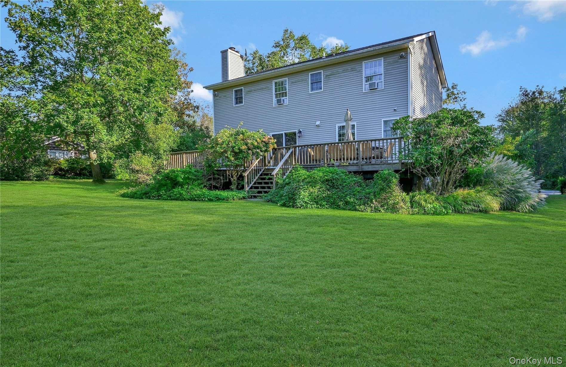 215 Kouros Road New Suffolk, NY 11956 - Photo 28 of 28 a front view of a house with garden