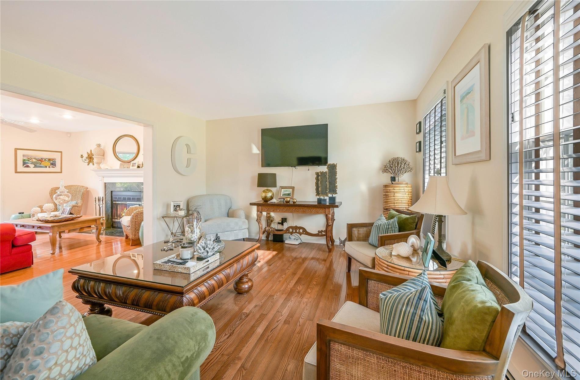 215 Kouros Road New Suffolk, NY 11956 - Photo 4 of 28 a living room with furniture kitchen view and a window