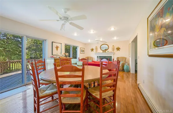 a view of a dining room with furniture window and wooden floor