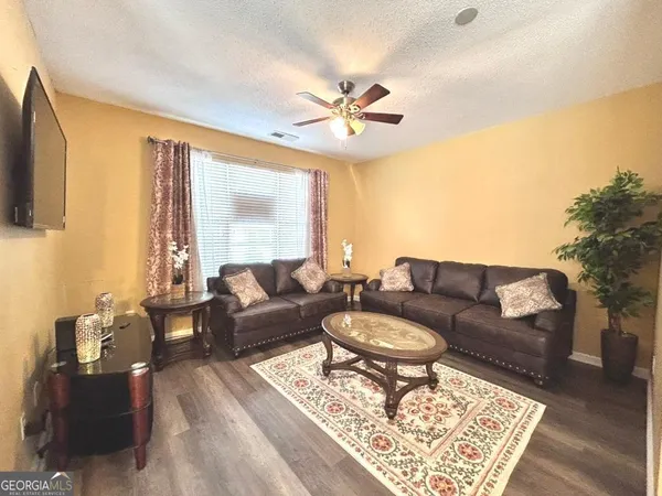 a living room with furniture and a large window