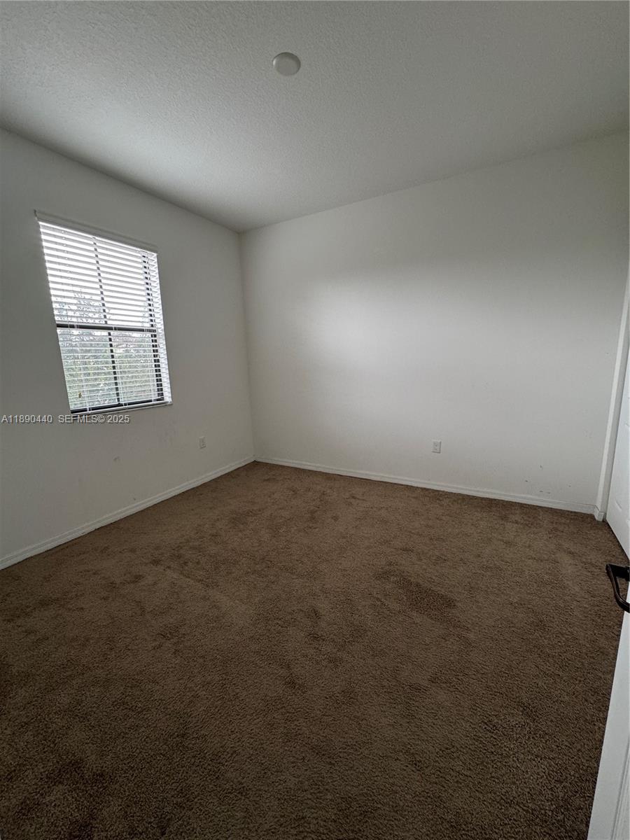 9079 Southwest 35th Street Miramar, FL 33025 - Photo 11 of 21 an empty room with a window