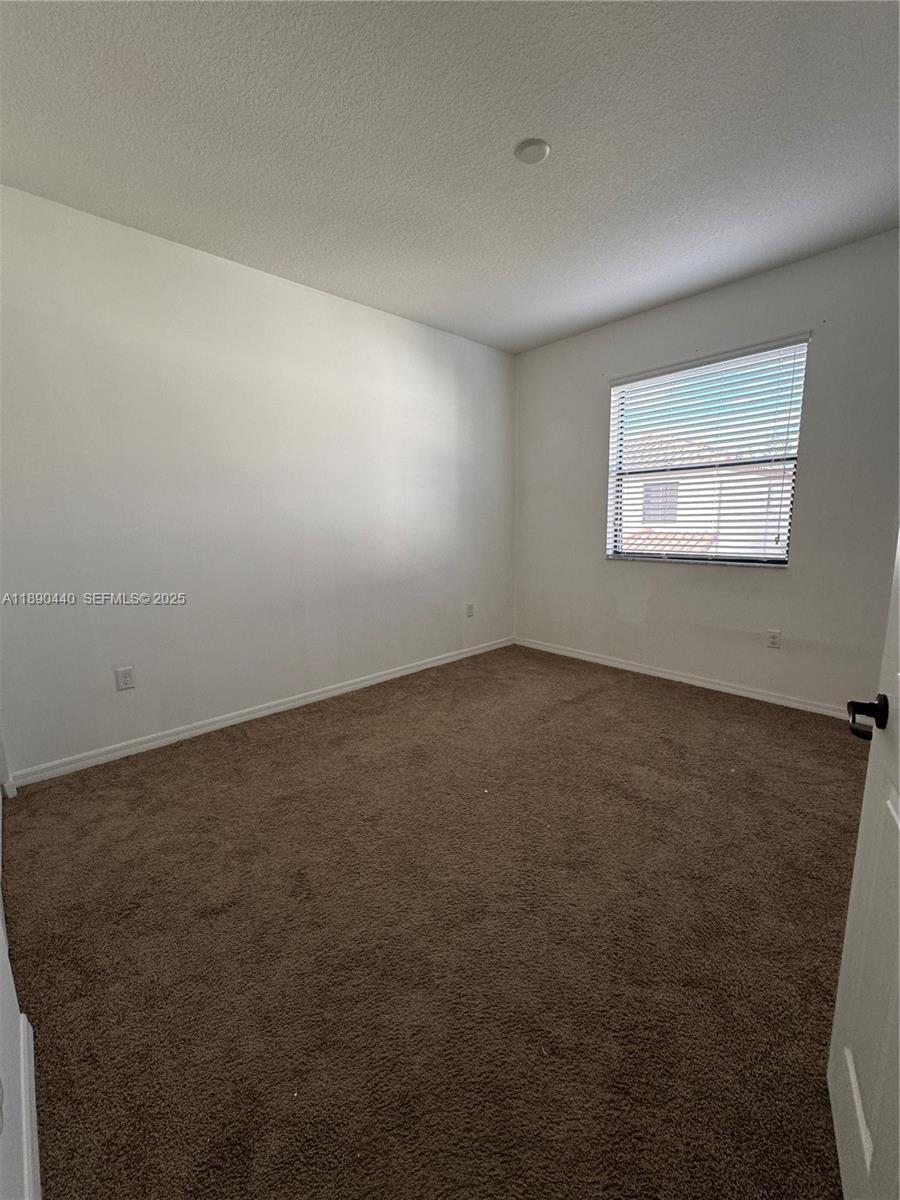 9079 Southwest 35th Street Miramar, FL 33025 - Photo 14 of 21 an empty room with a empty space and window