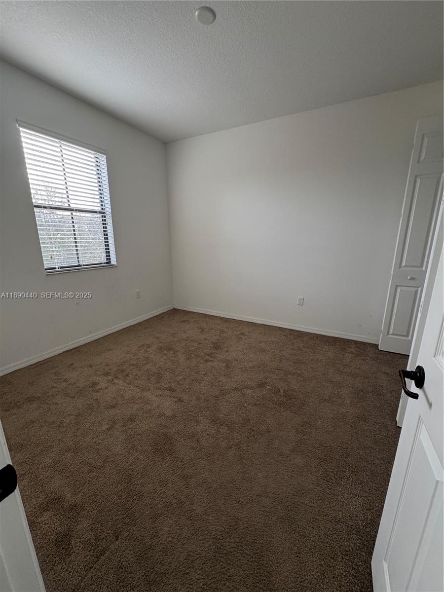 9079 Southwest 35th Street Miramar, FL 33025 - Photo 17 of 21 an empty room with windows