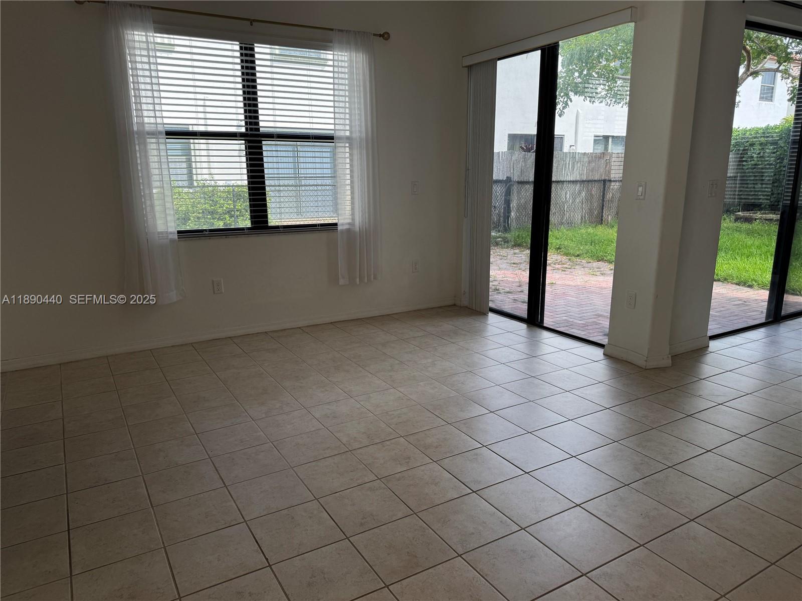 9079 Southwest 35th Street Miramar, FL 33025 - Photo 5 of 21 an empty room with windows