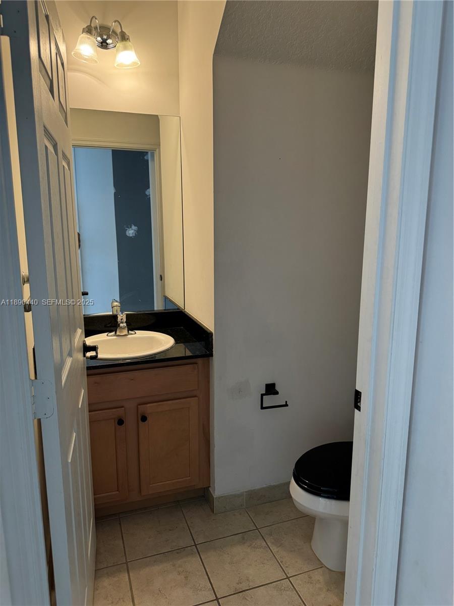 9079 Southwest 35th Street Miramar, FL 33025 - Photo 8 of 21 a bathroom with a sink and a mirror