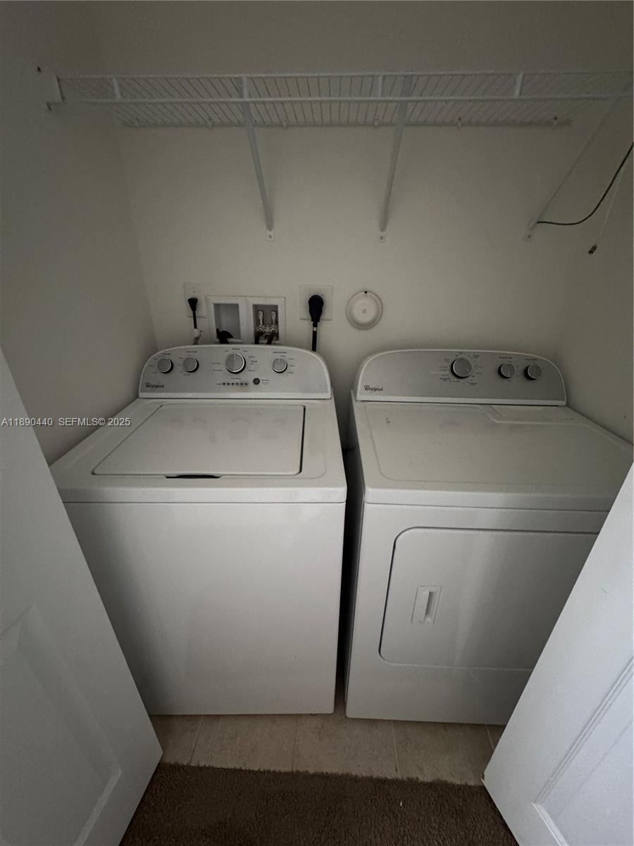 9079 Southwest 35th Street Miramar, FL 33025 - Photo 10 of 21 a utility room with dryer and washer