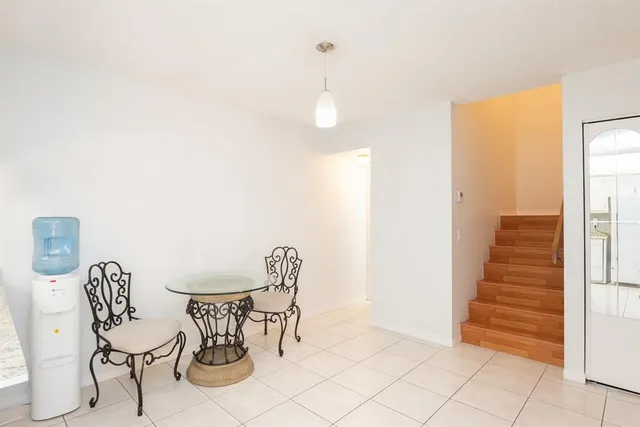 a view of a room with furniture and wooden floor