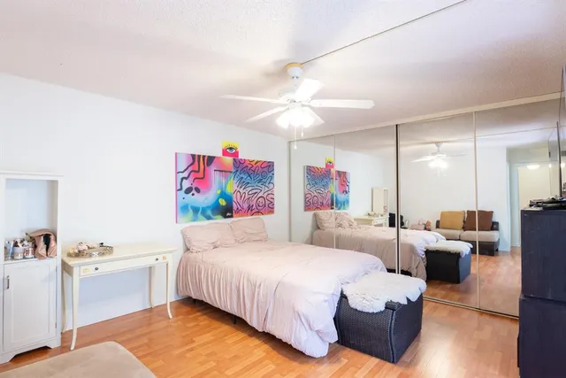a bedroom with furniture and a chandelier