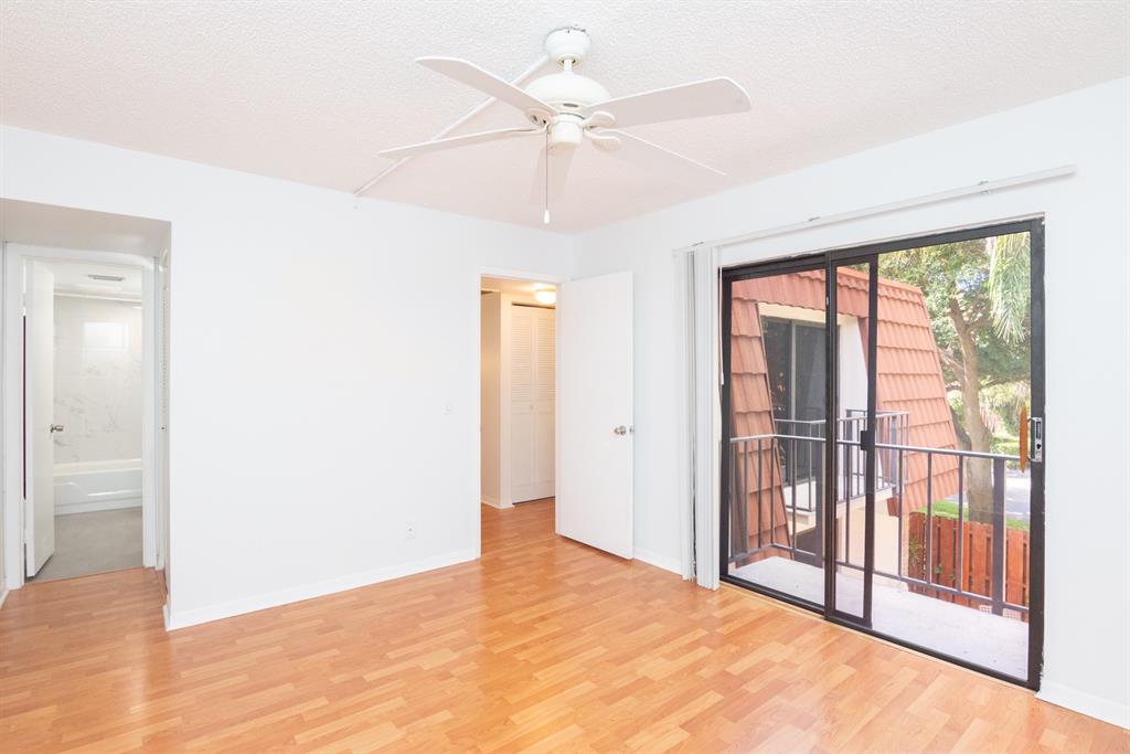 3118 Spanish Wells Drive, Unit 15C Delray Beach, FL 33445 - Photo 17 of 40 a view of an empty room with a window