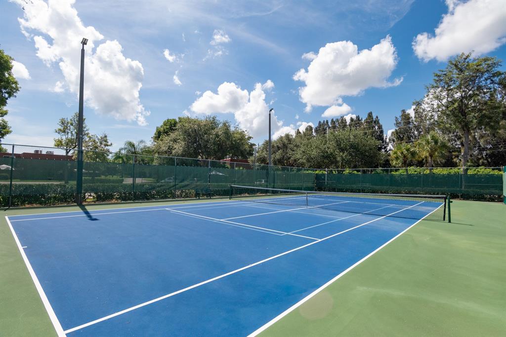 3118 Spanish Wells Drive, Unit 15C Delray Beach, FL 33445 - Photo 30 of 40 a view of a tennis court