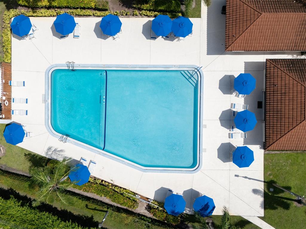 3118 Spanish Wells Drive, Unit 15C Delray Beach, FL 33445 - Photo 35 of 40 a bathroom with a sink and a mirror