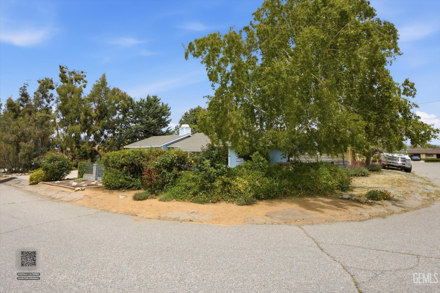 Undisclosed Address Tehachapi, CA 93561 - Photo 11 of 48 a street view with large trees