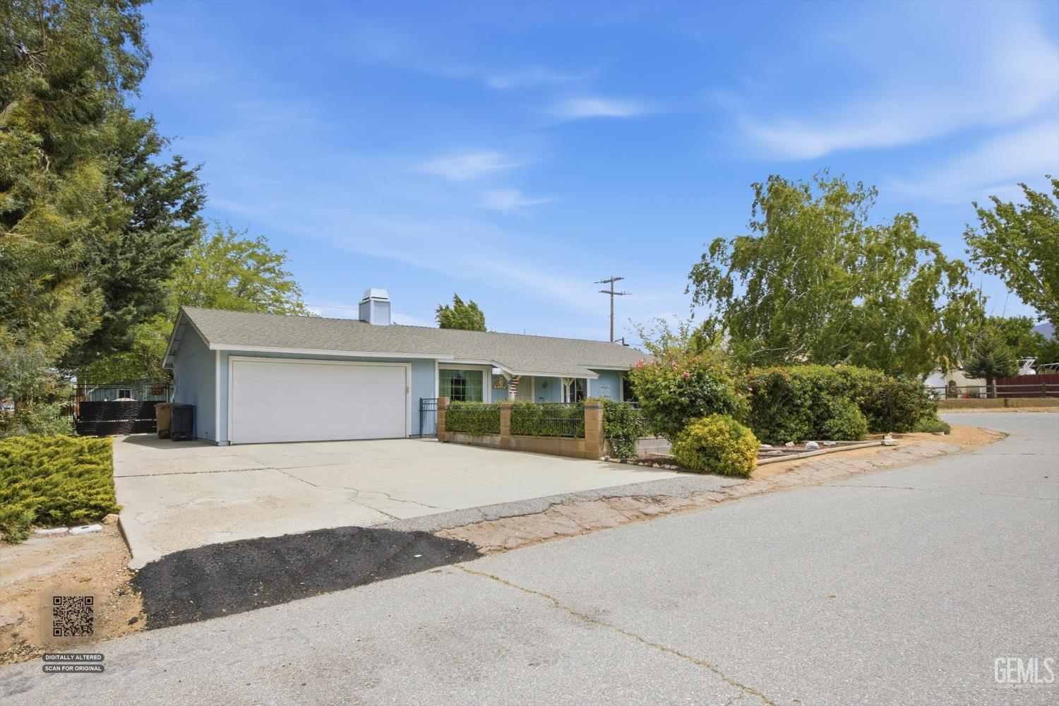 Undisclosed Address Tehachapi, CA 93561 - Photo 13 of 48 a front view of a house with a yard and garage